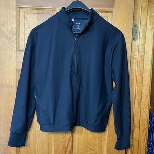 women's black under armor light weight zip jacket. Medium